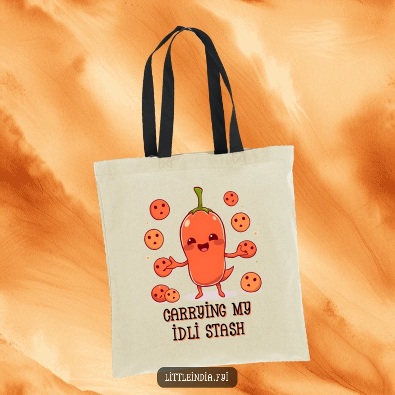 Funny chili pepper character juggling idlis printed on a durable tote bag, ideal for groceries or daily essentials.
